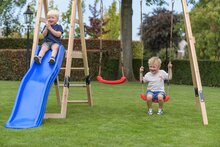 Holzspielplatz Ava mit gr&uuml;ner Rutsche