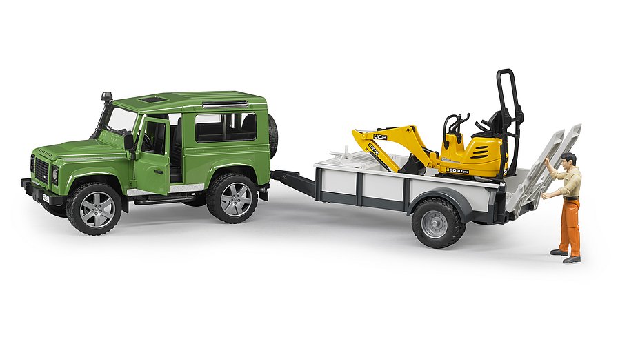 Land Rover Defender Station Wagon mit Einachsanhänger, JCB Mikrobagger 8010 CTS und Bauarbeiter